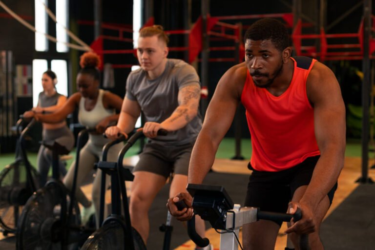Image of cyclists on stationary bikes performing a high-intensity interval workout.